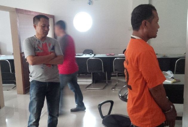 Suhandoyo salah seorang pelaku yang merupakan eksekutor saat diamankan di Mapolda Jambi